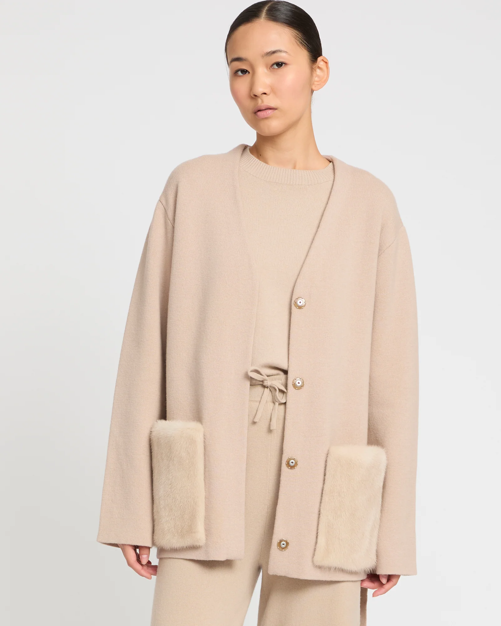 Belted knit and mink jacket